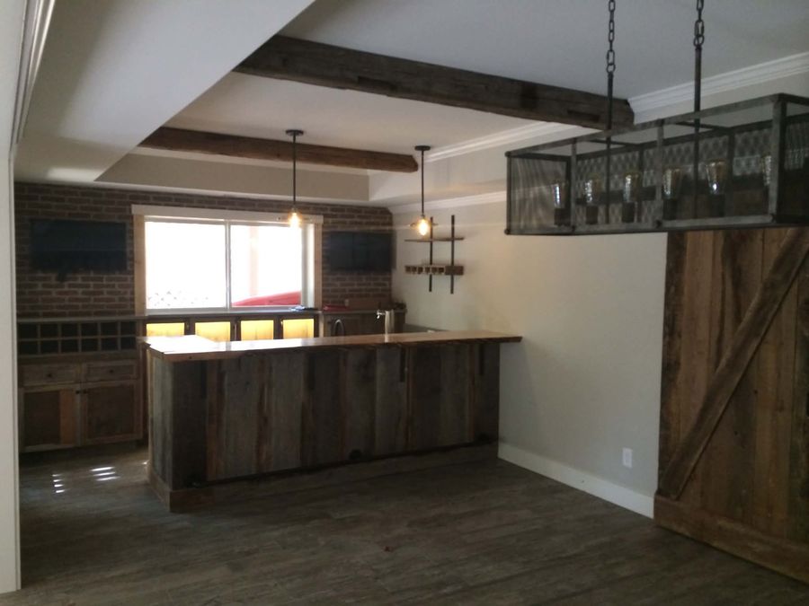 Basement bar built from reclaimed barn wood